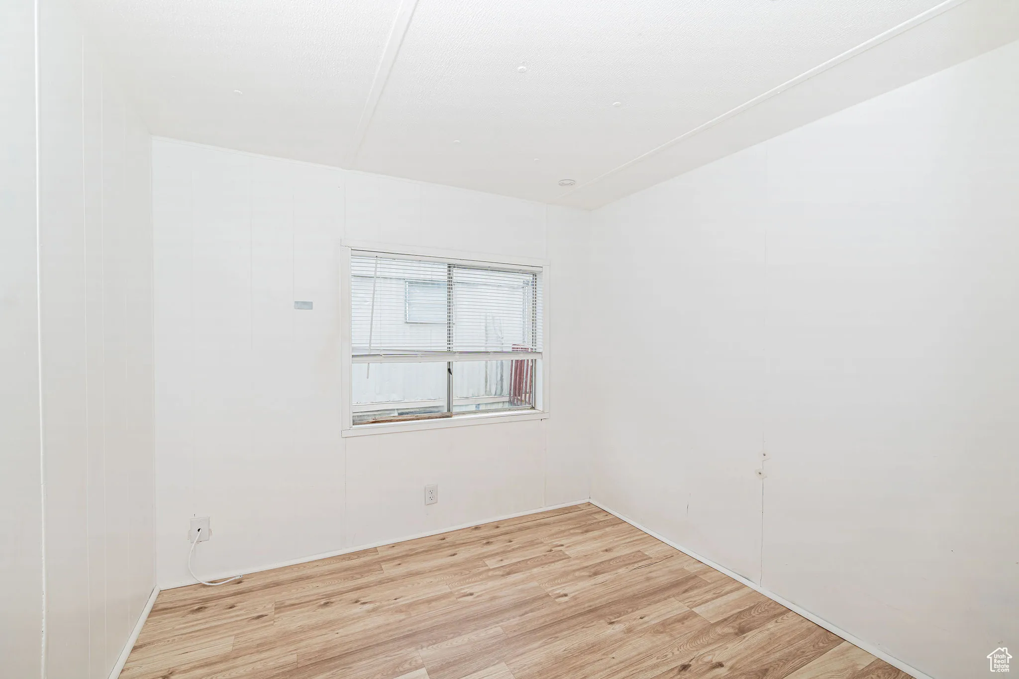 Unfurnished room featuring light wood-style floors
