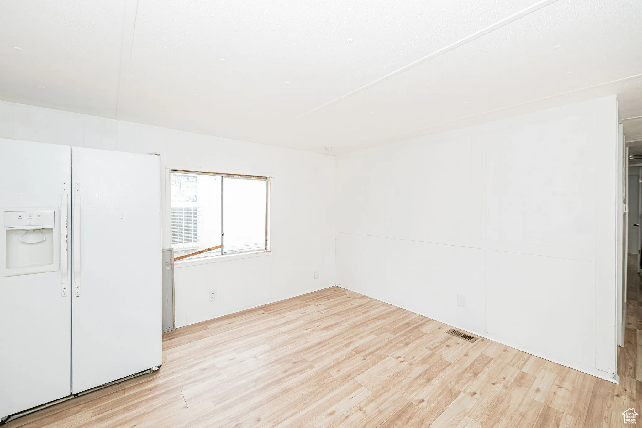 Unfurnished room featuring wood finished floors