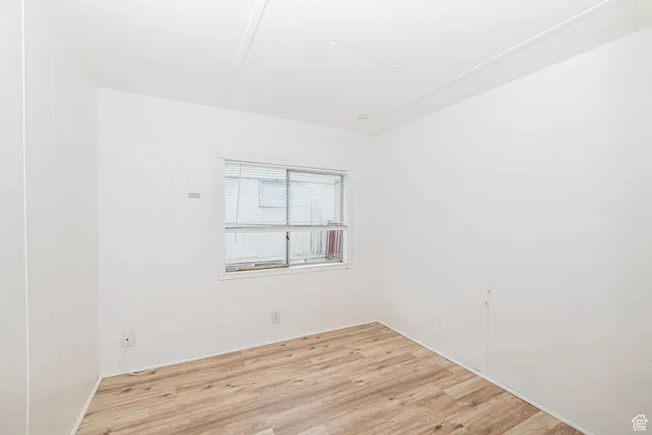 Unfurnished room featuring light wood-style floors