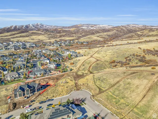Aerial perspective of suburban area featuring a mountainous background