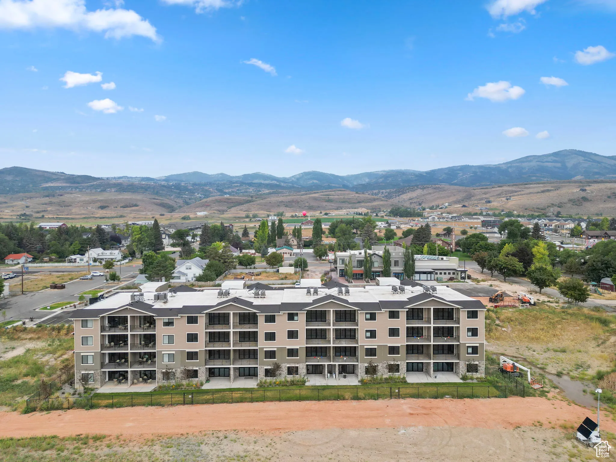 Aerial view of mountains and apartment complex / building