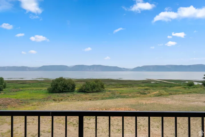 View of mountain backdrop featuring a nearby body of water