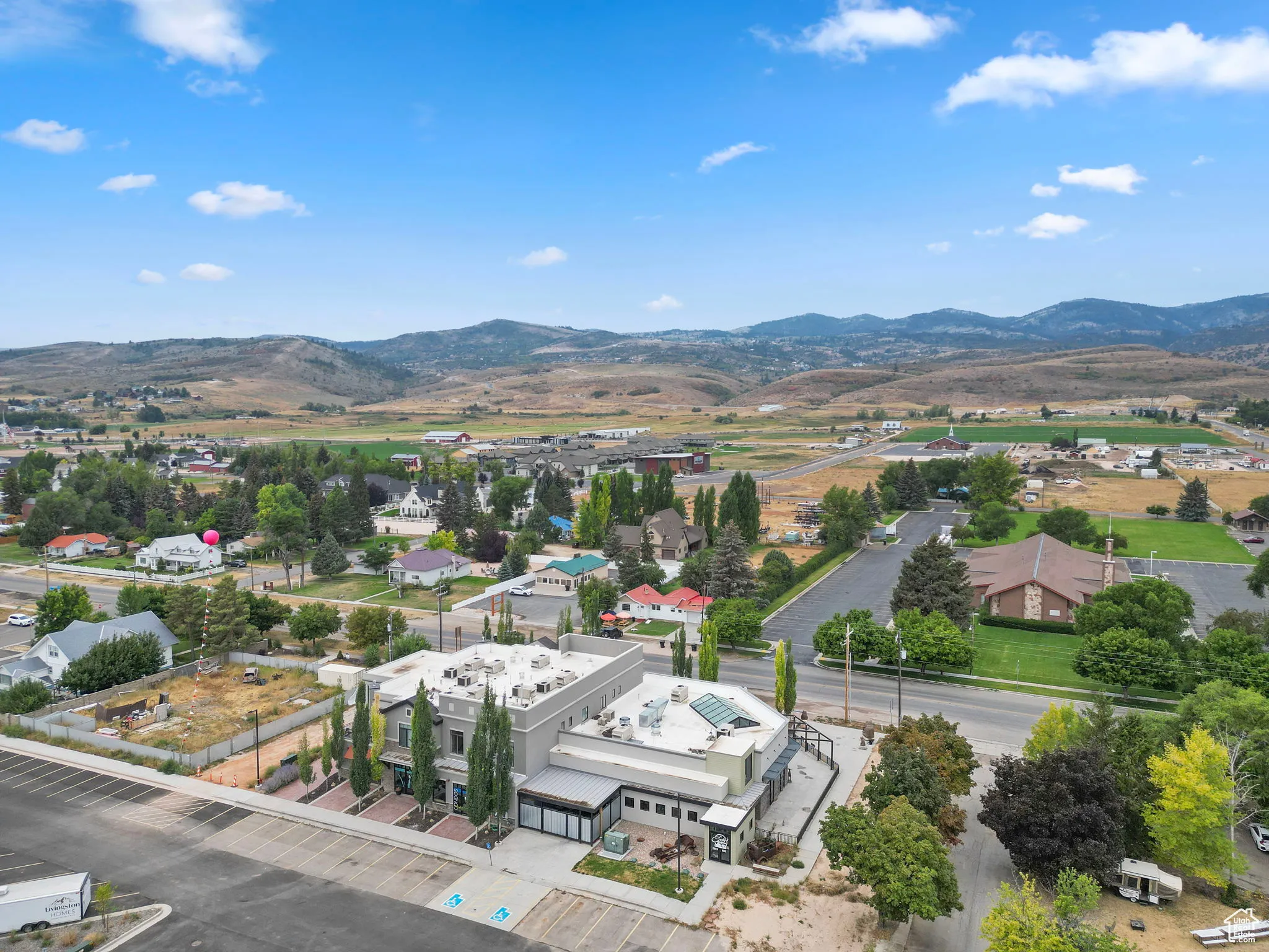 Aerial view of residential area featuring mountains