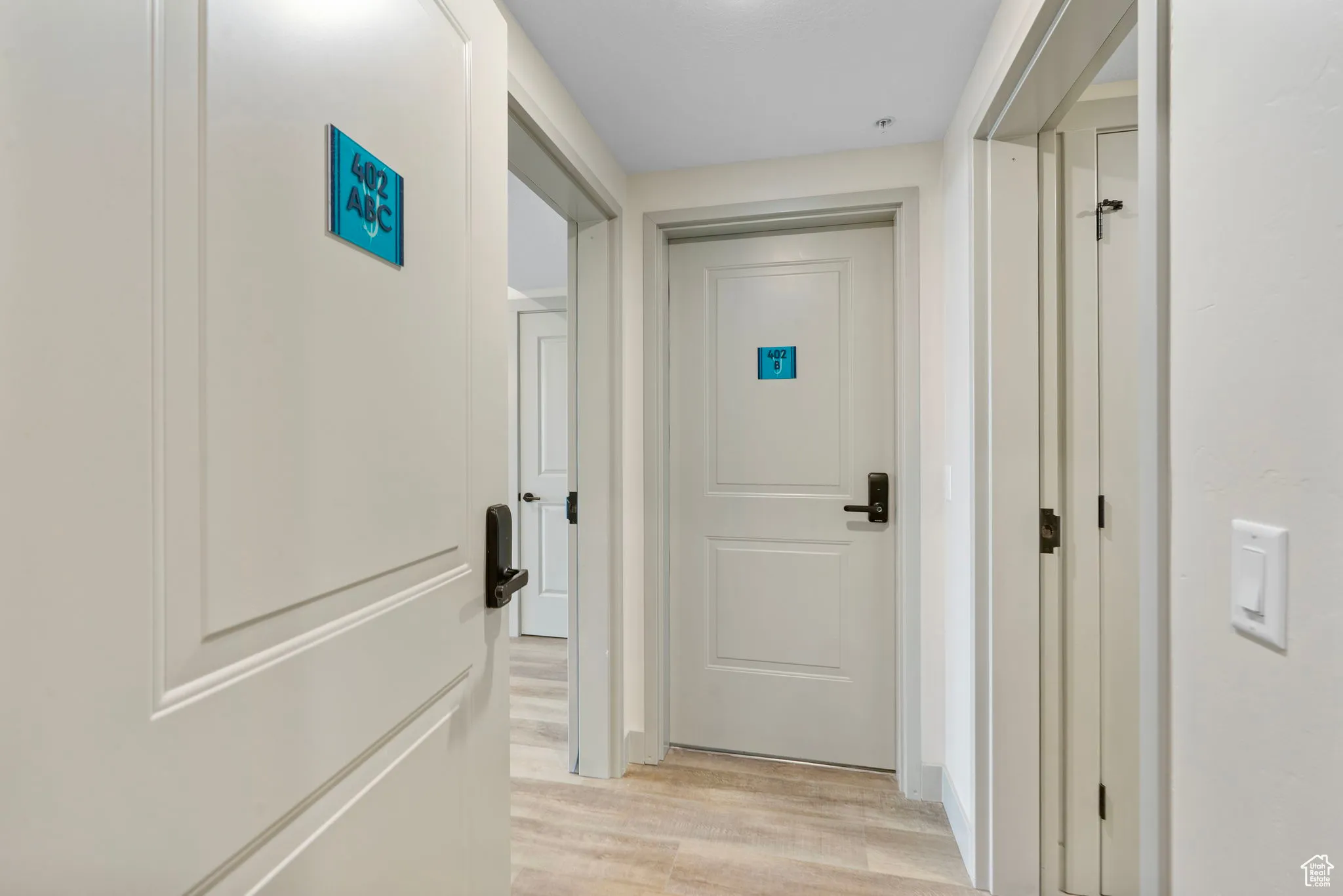 Hallway with light wood-type flooring