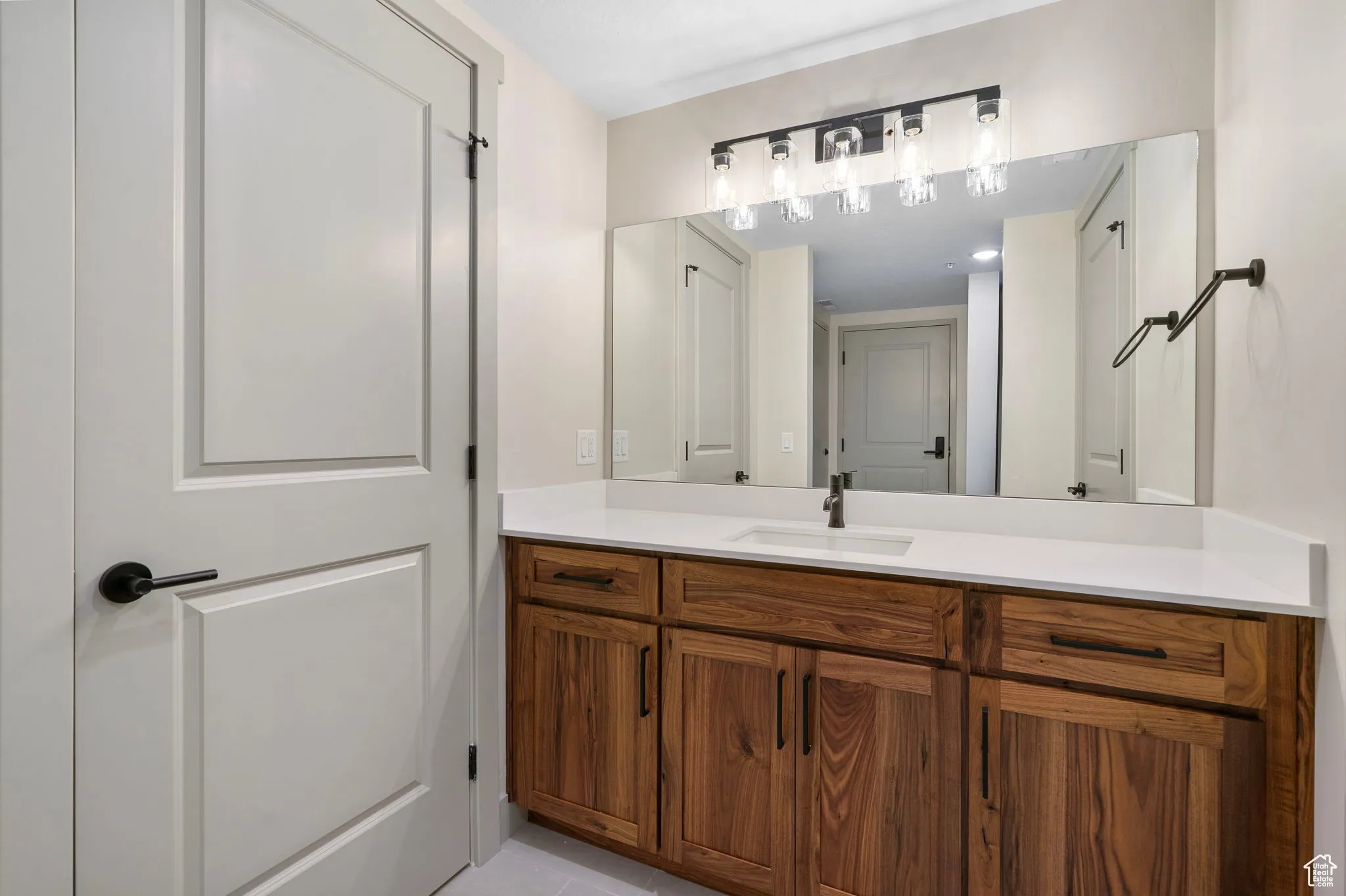 Bathroom with vanity and light tile patterned floors