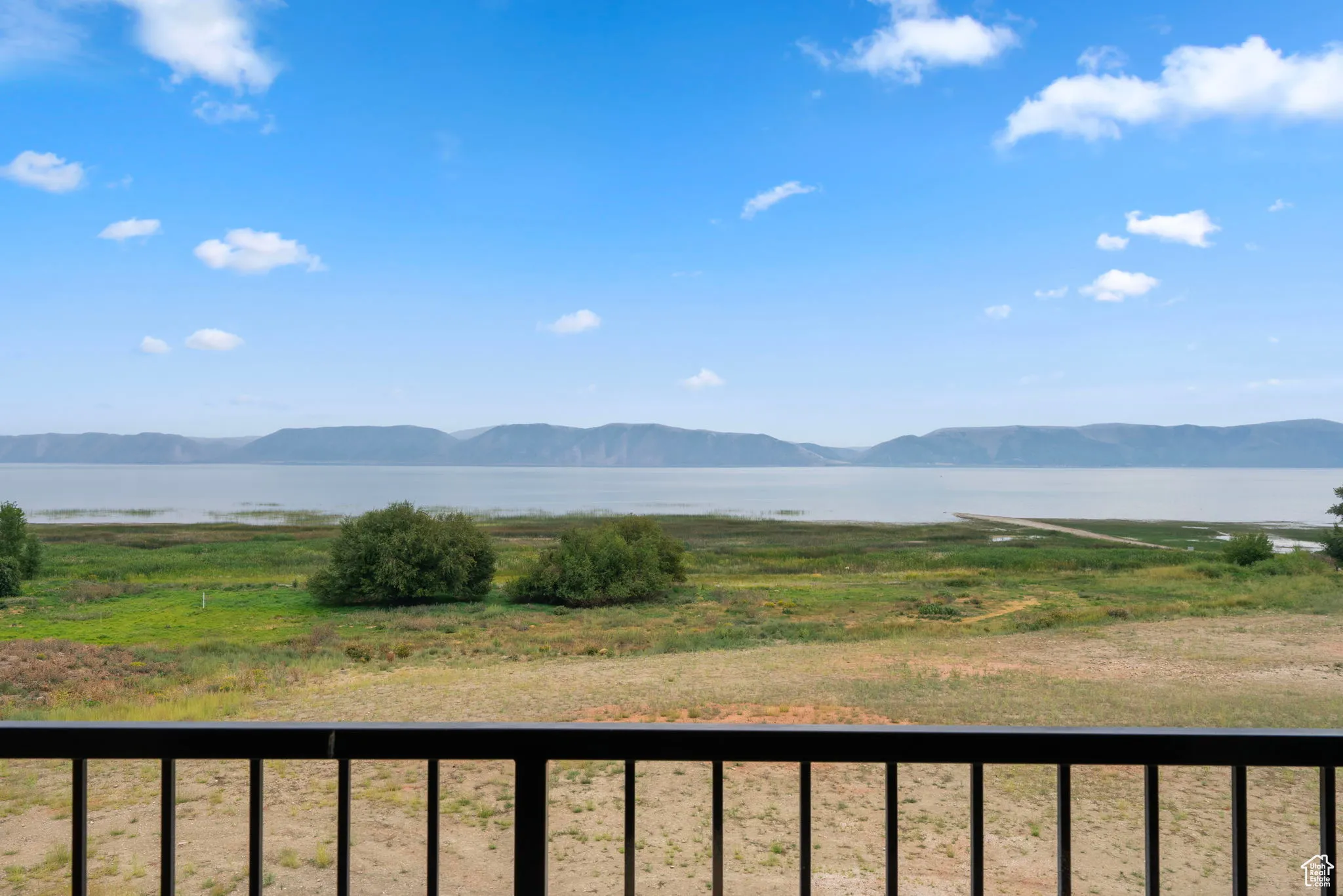 View of mountain backdrop featuring a nearby body of water