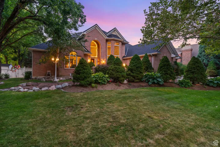 Traditional-style home featuring brick siding
