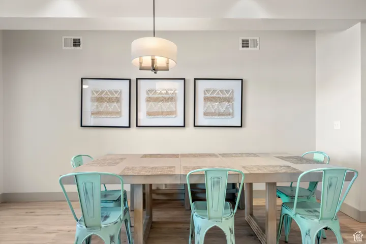 Dining space with baseboards and wood finished floors