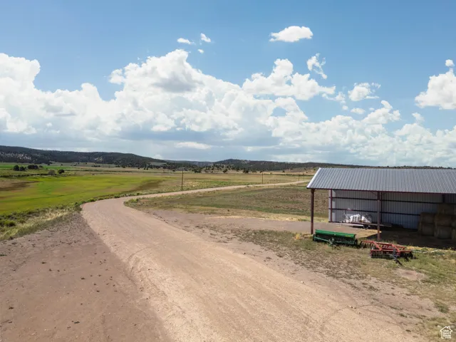 View of road featuring an outbuilding and a view of countryside