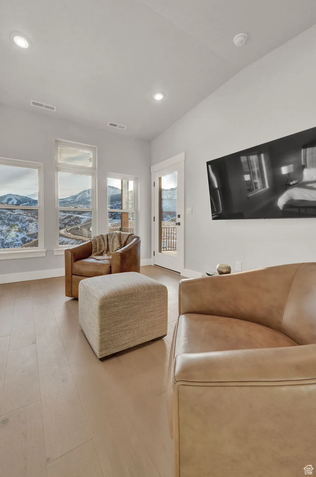 Living room featuring recessed lighting, baseboards, and wood finished floors
