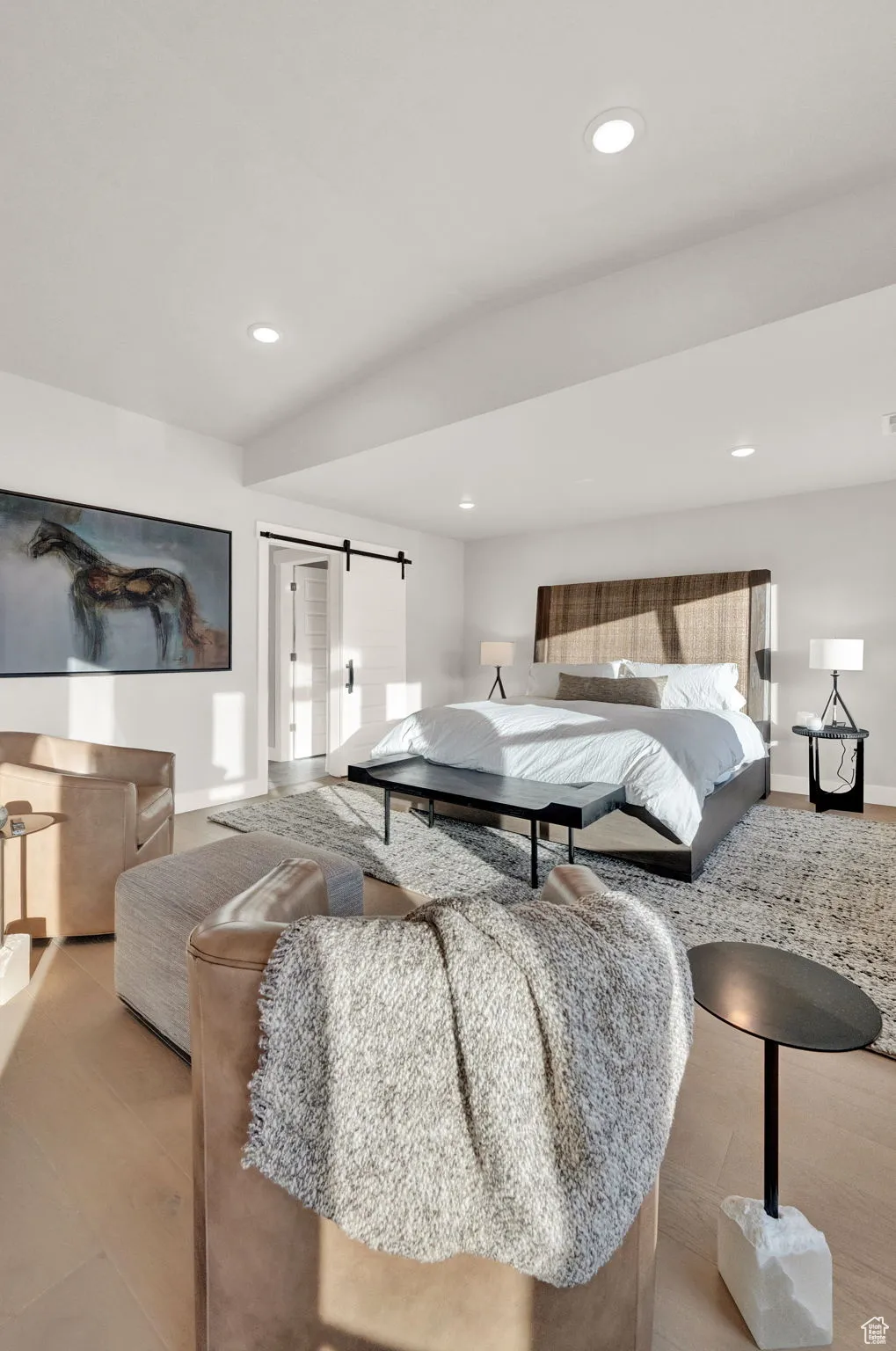 Bedroom featuring baseboards, recessed lighting, and a barn door