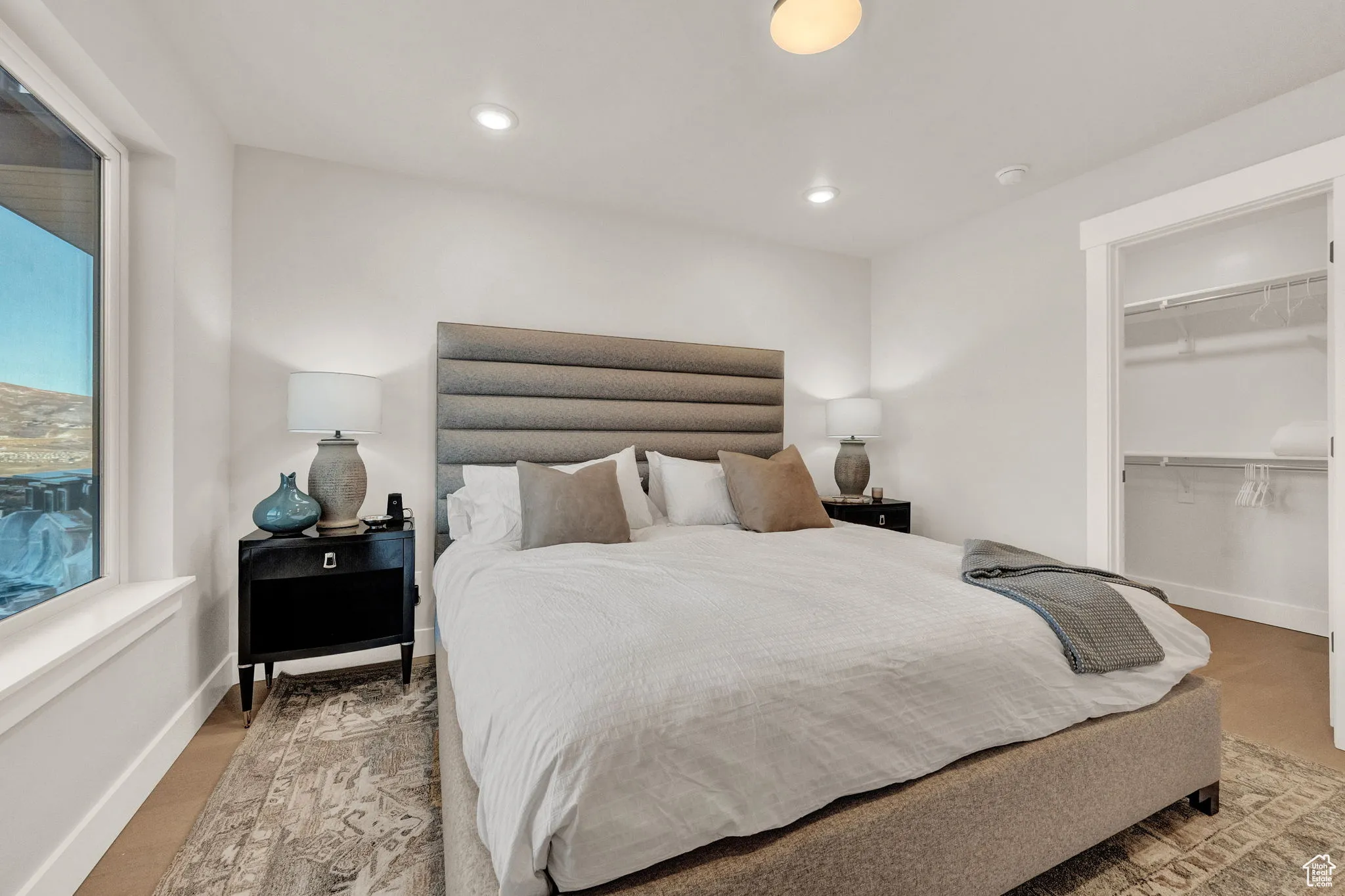 Bedroom featuring a spacious closet, baseboards, recessed lighting, and a closet