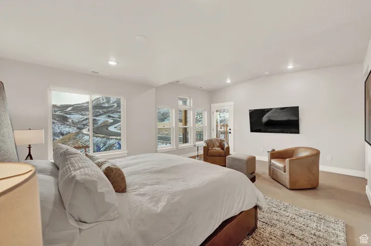 Bedroom featuring recessed lighting, baseboards, and light tile patterned floors