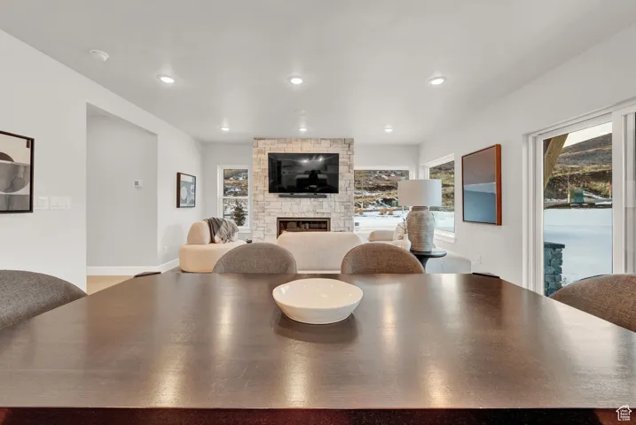 Dining space featuring a fireplace and recessed lighting