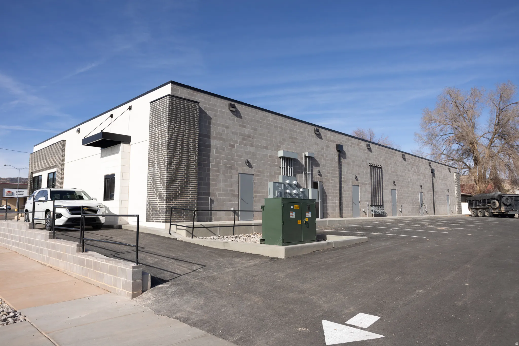 View of property with uncovered parking