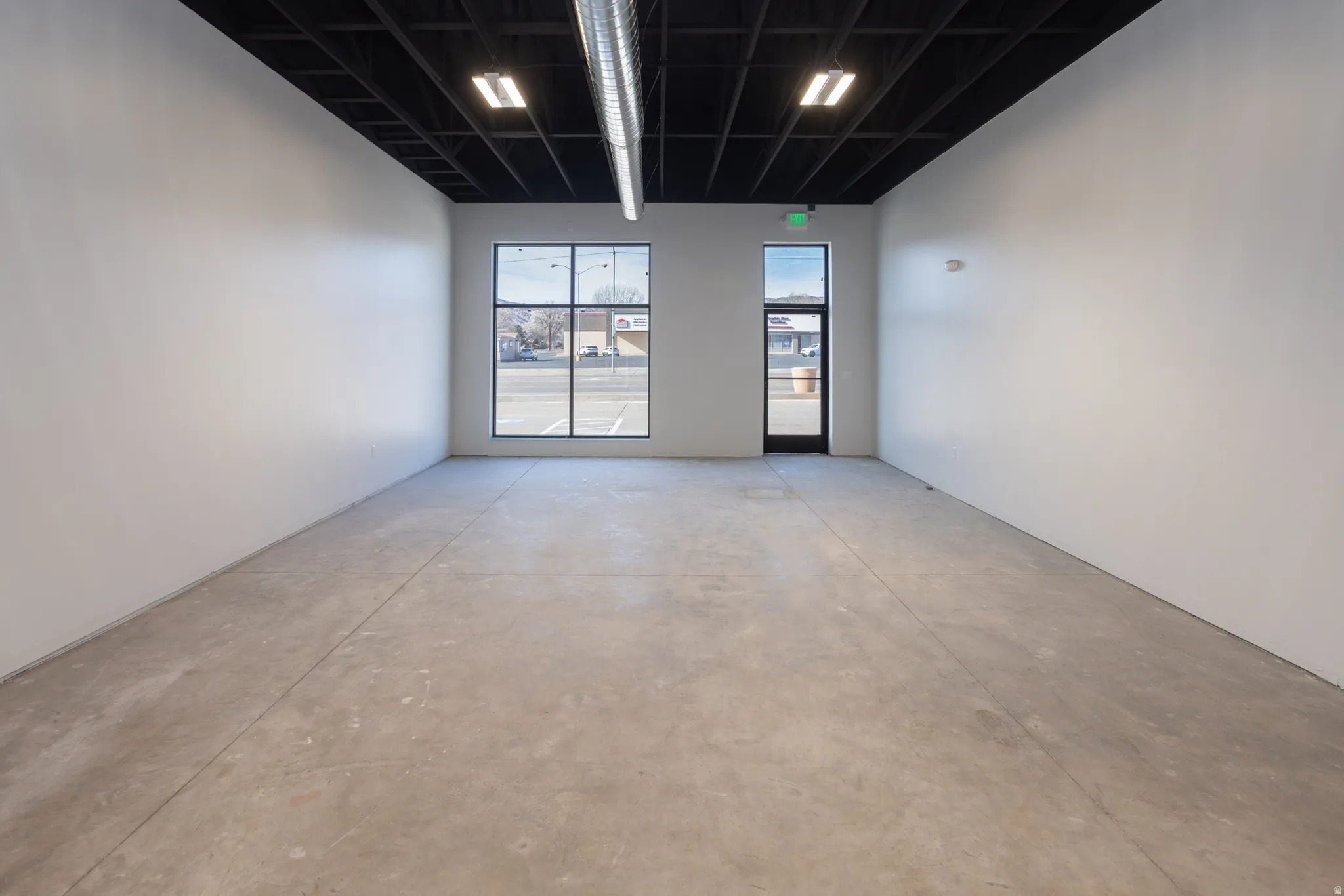 Unfurnished room featuring concrete floors