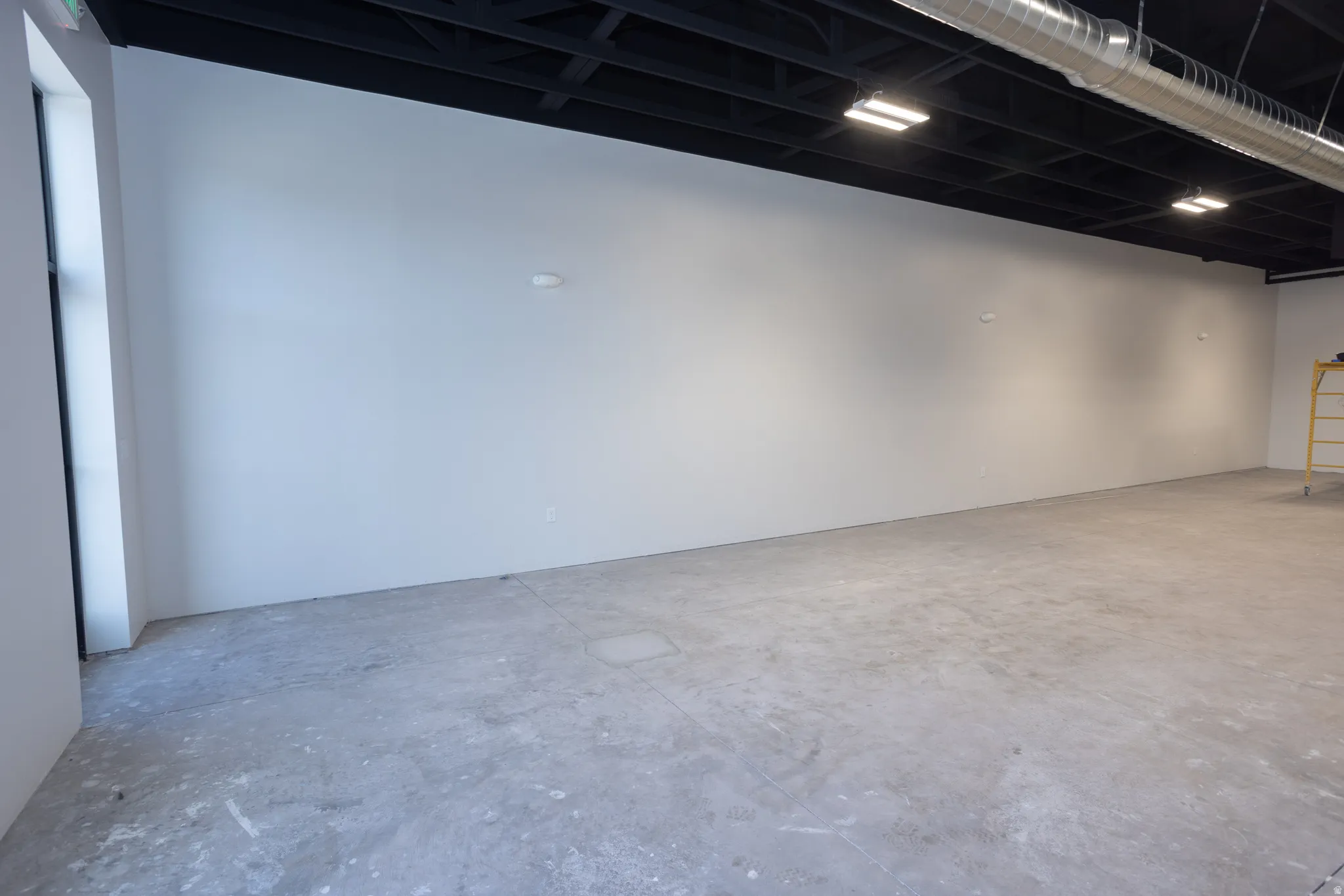 Miscellaneous room featuring concrete floors