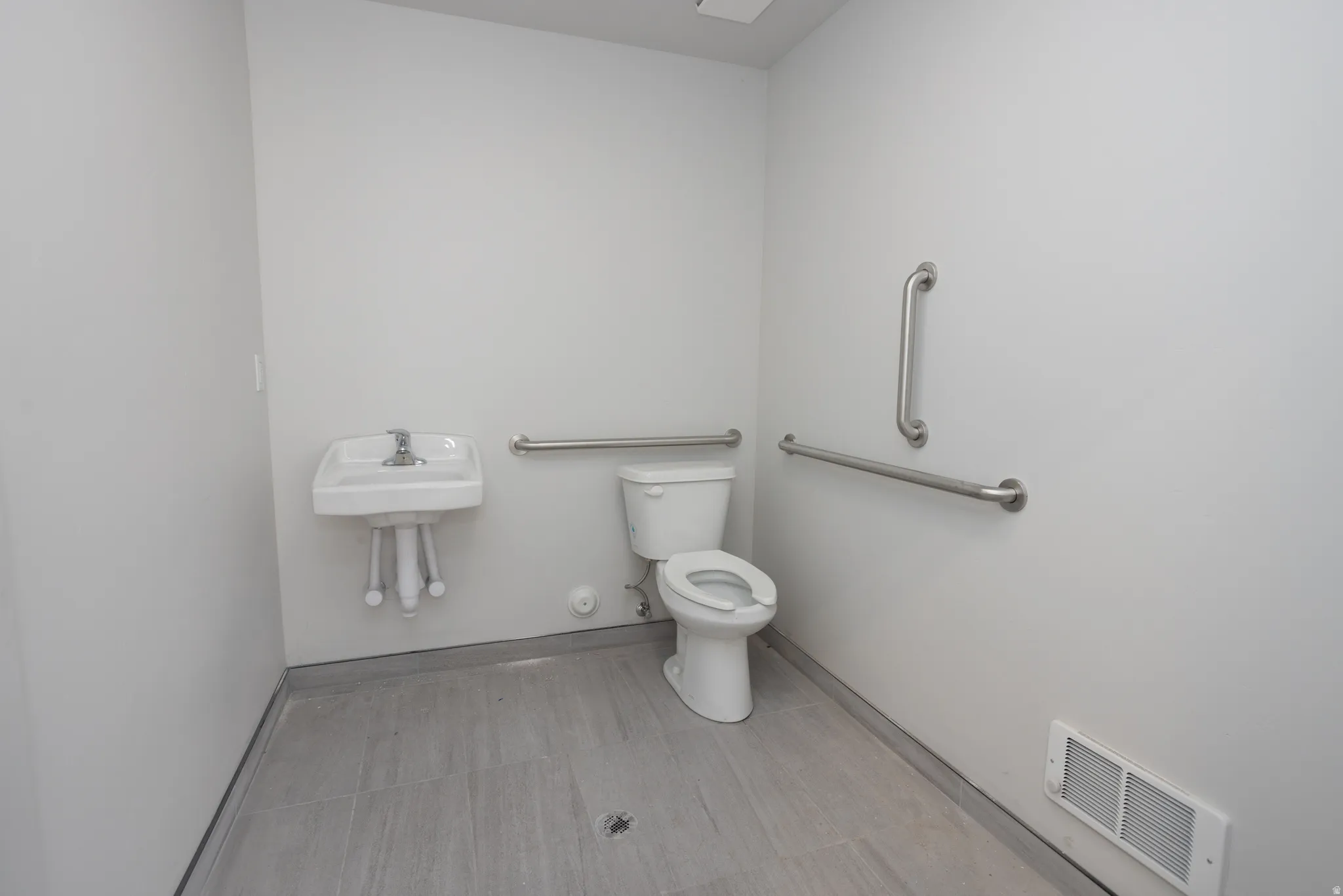 Bathroom featuring toilet and baseboards