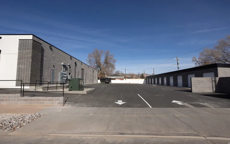 View of concrete road featuring community garages