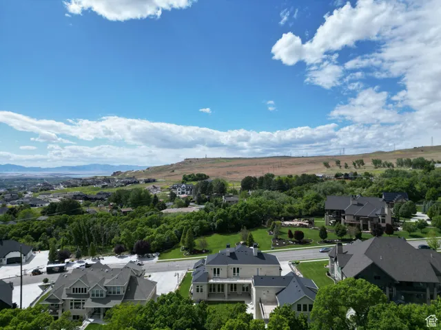 Aerial view of residential area featuring a mountain backdrop