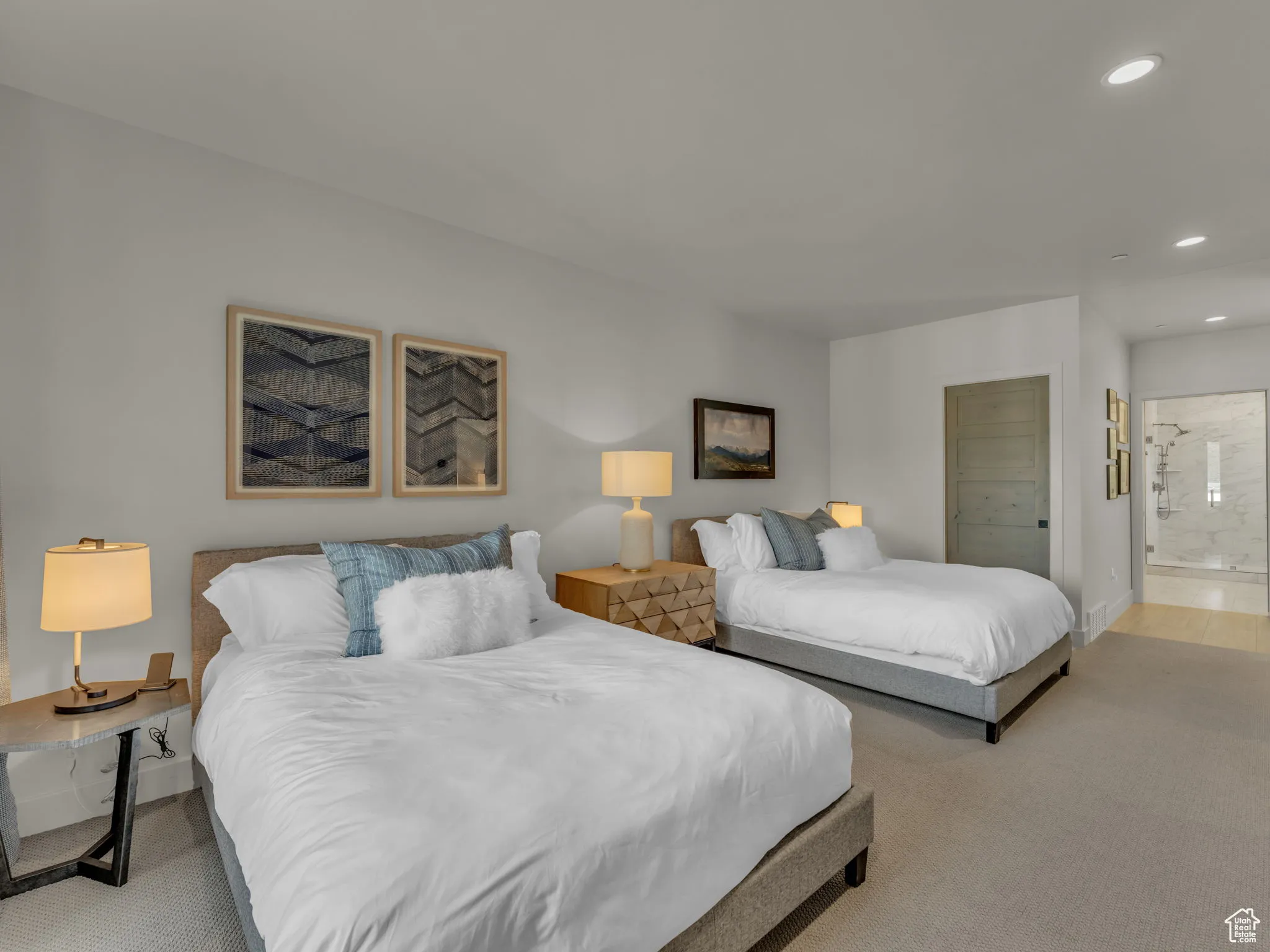 Bedroom with light carpet, recessed lighting, baseboards, and connected bathroom