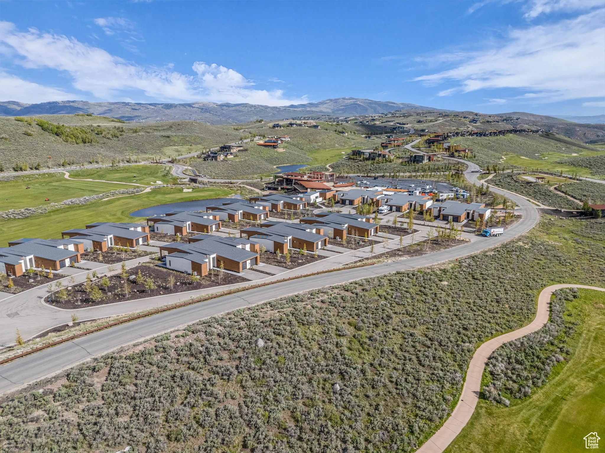 Aerial view of residential area featuring a mountainous background