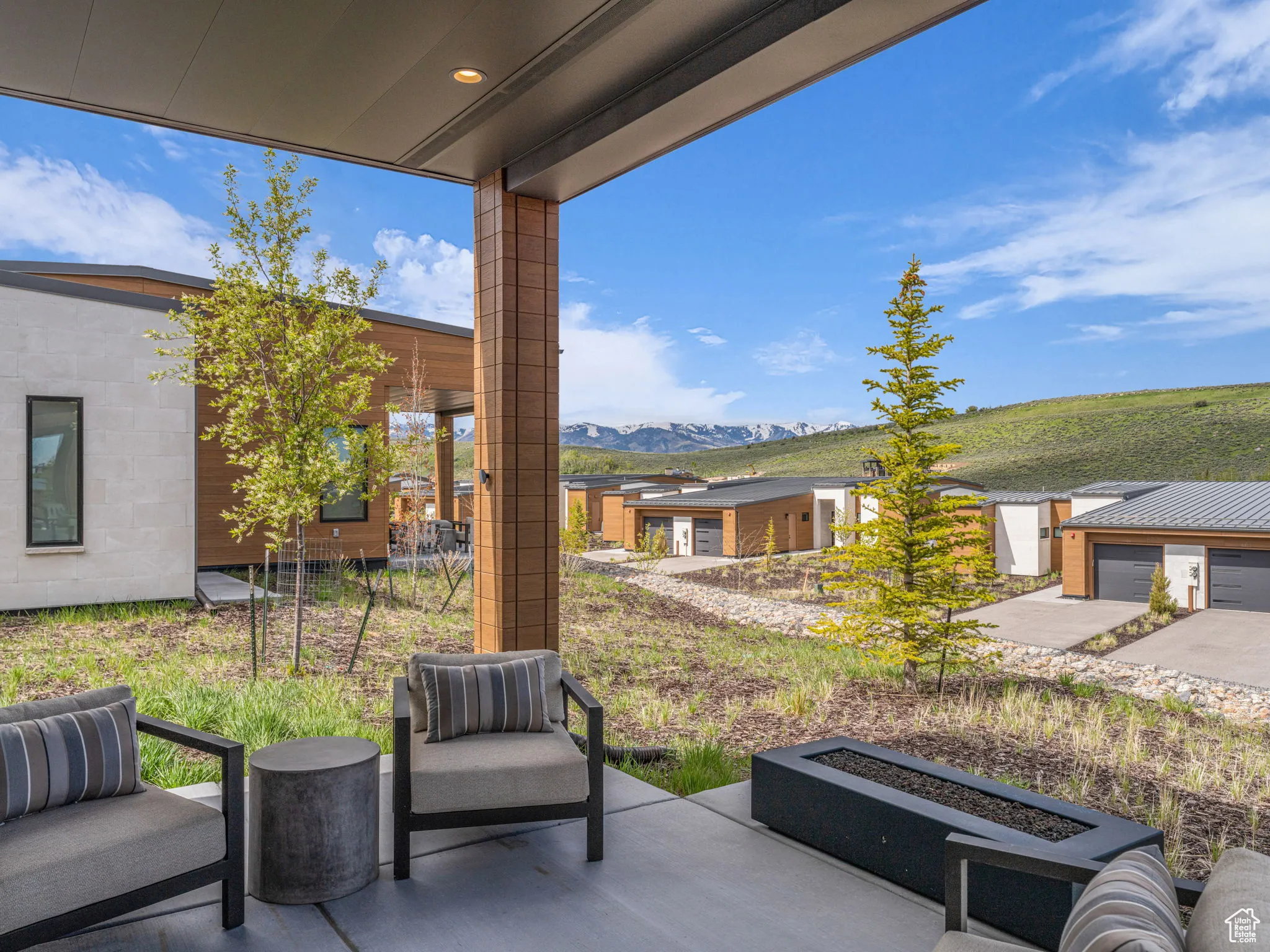 View of patio / terrace with a firepit, and ski mountain view