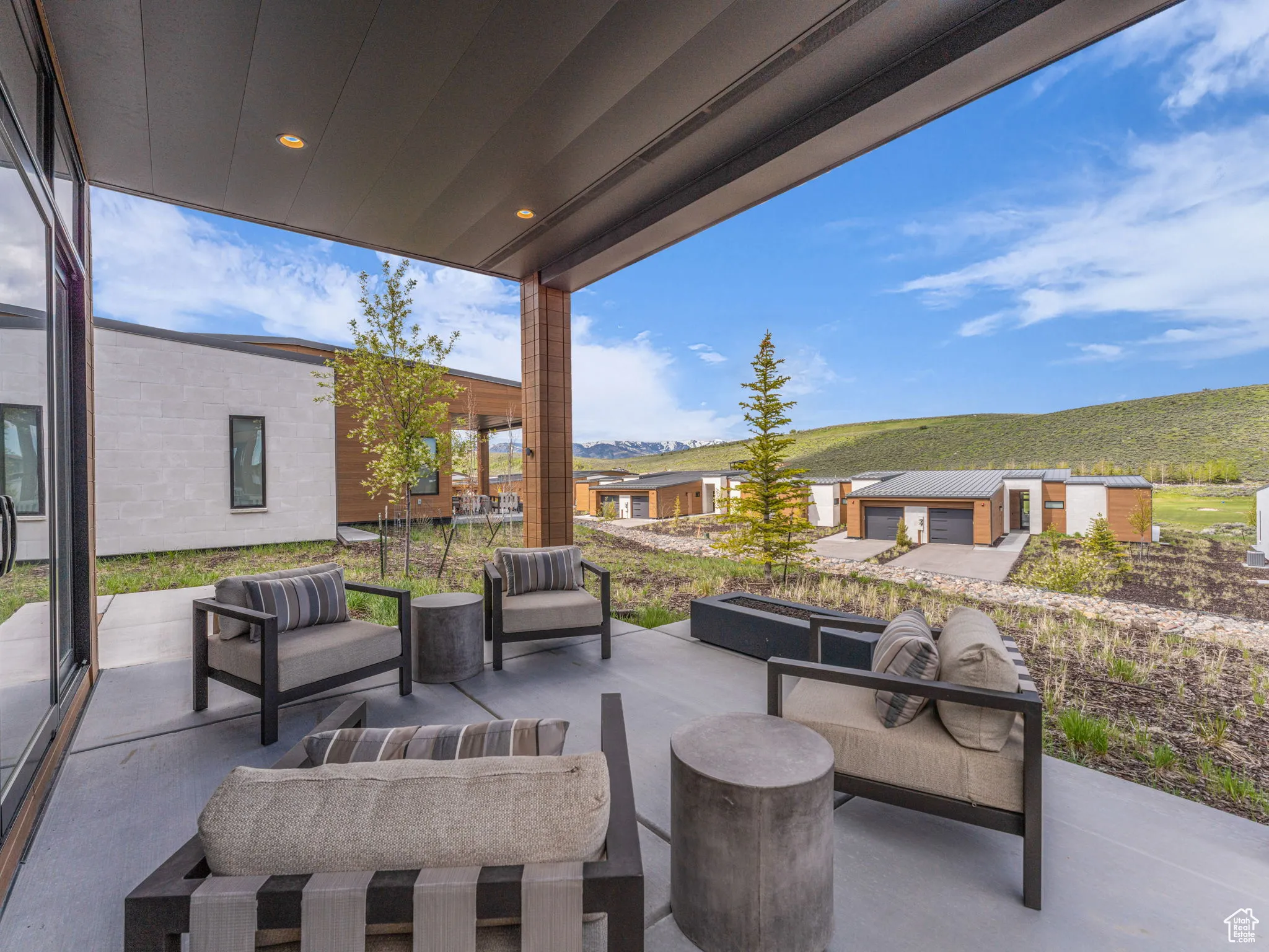View of patio with outdoor lounge area, firepit,  and a mountain view