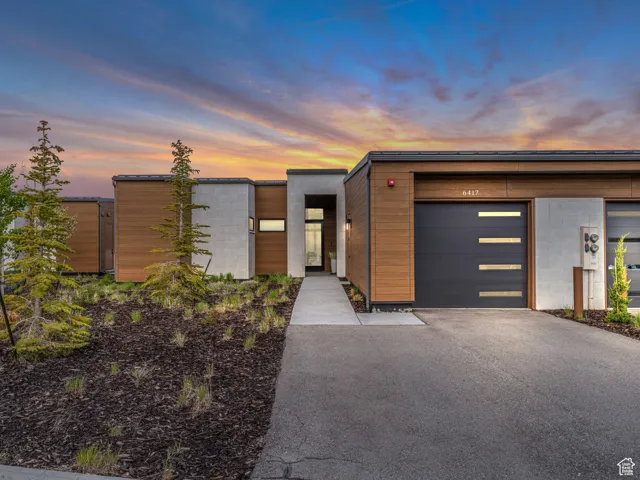Contemporary home with driveway and an attached garage