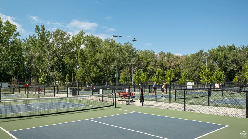 View of tennis court with community basketball court
