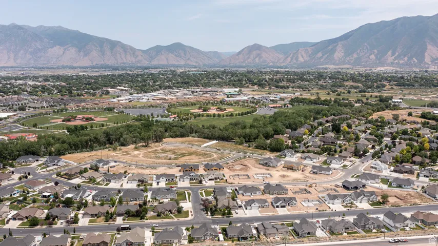 View of property location with a mountainous background and nearby suburban area