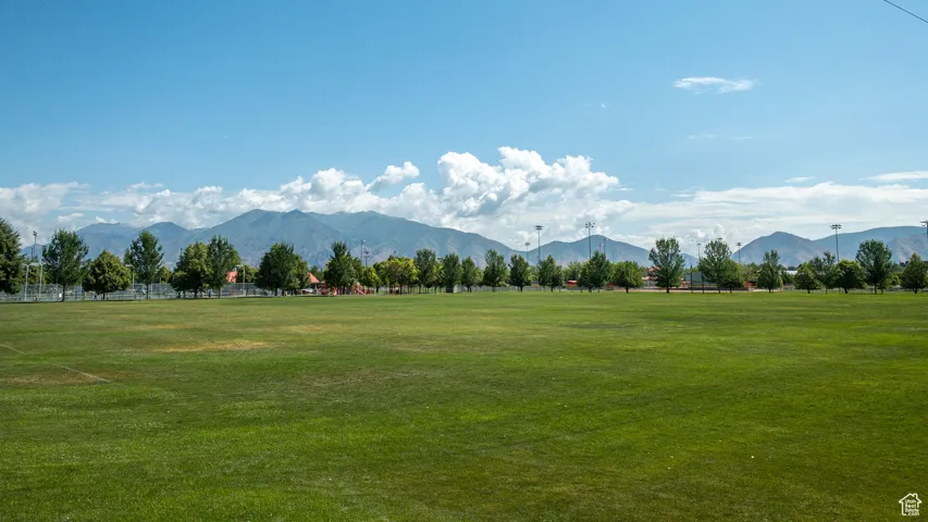 View of mountain backdrop with rural landscape
