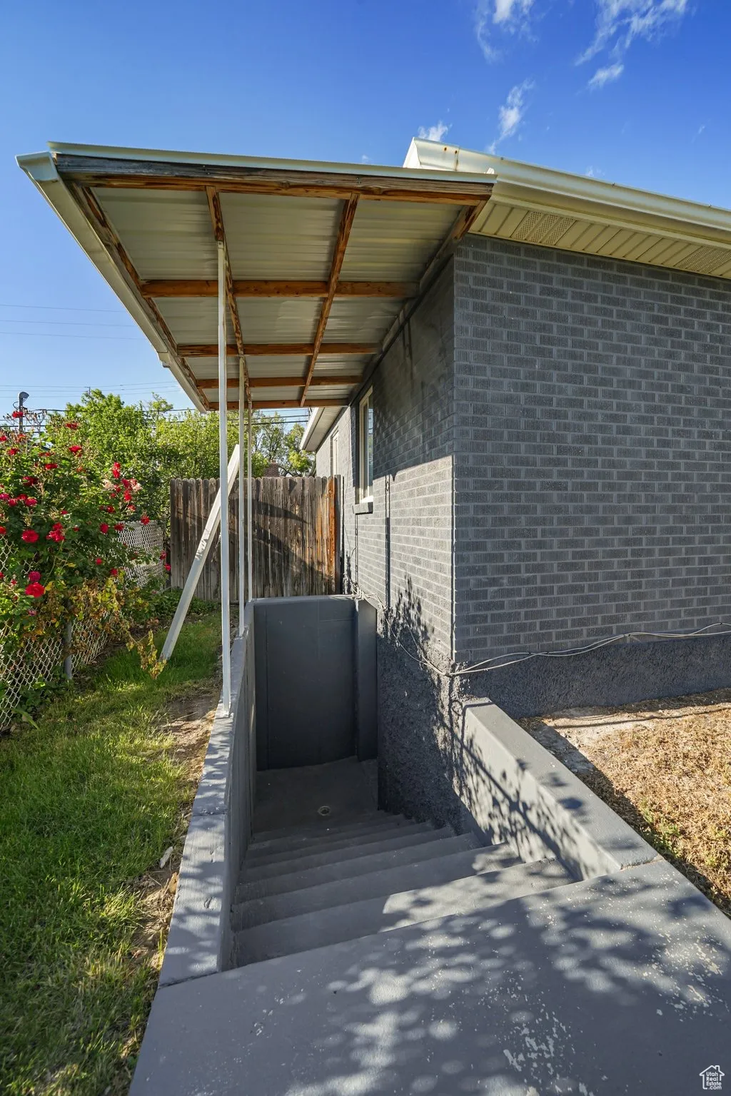 Exterior space featuring brick siding
