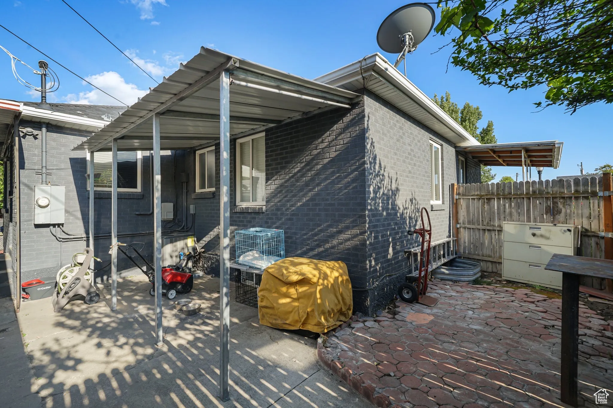 Back of property with brick siding