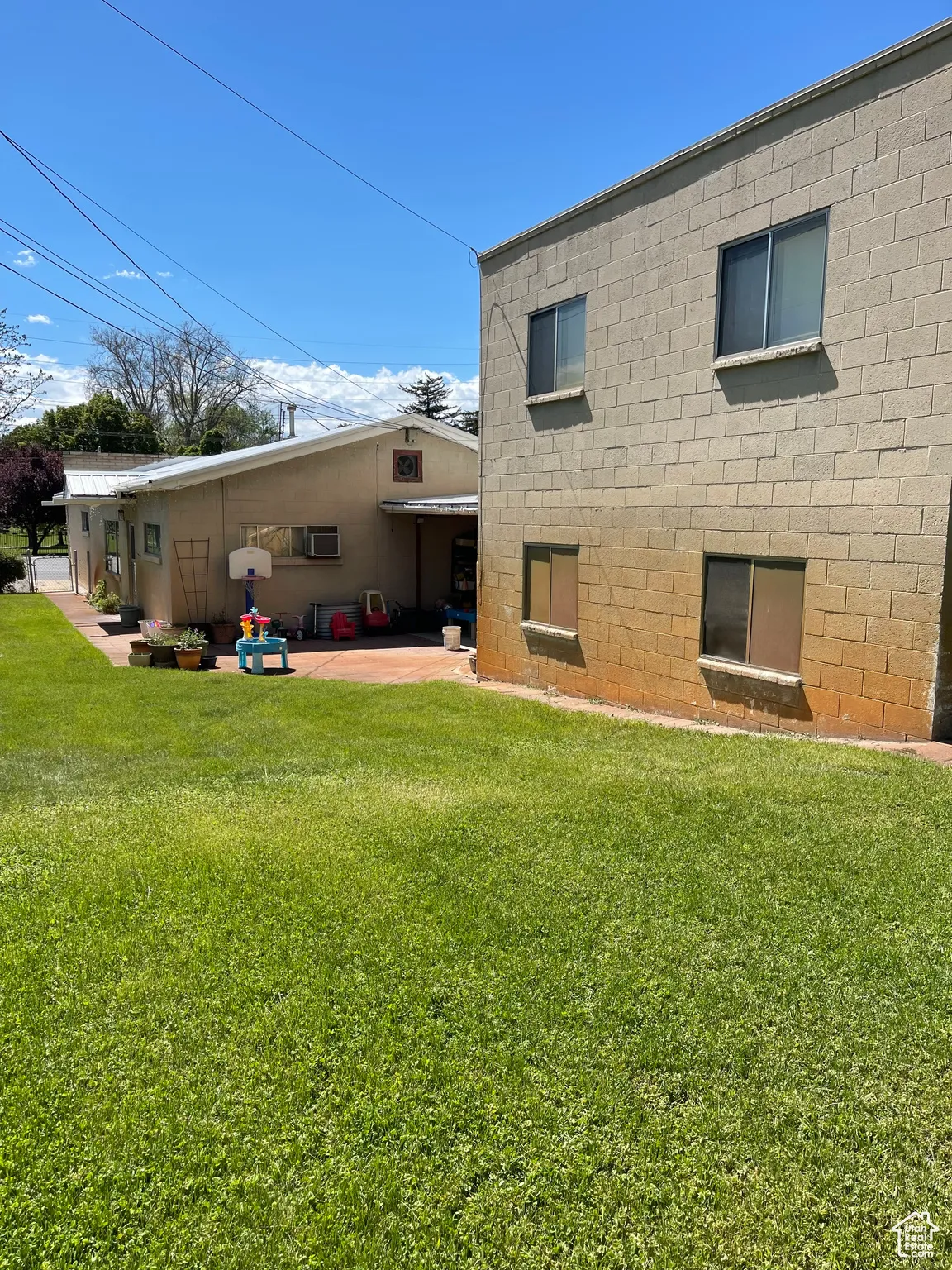 Side & rear view of front apartment and rear apartment/ storage area