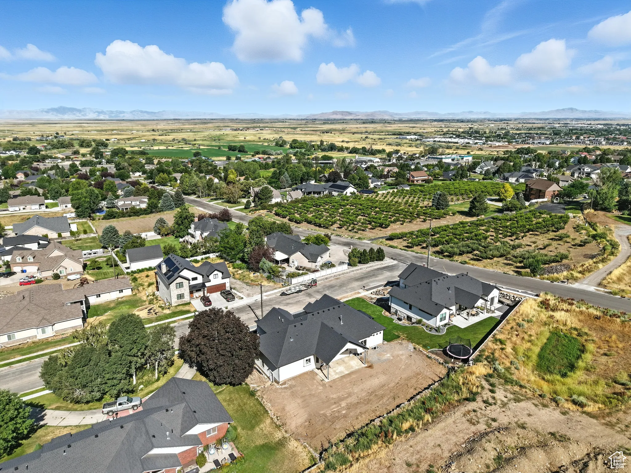 Aerial view of property's location featuring nearby suburban area and rural landscape