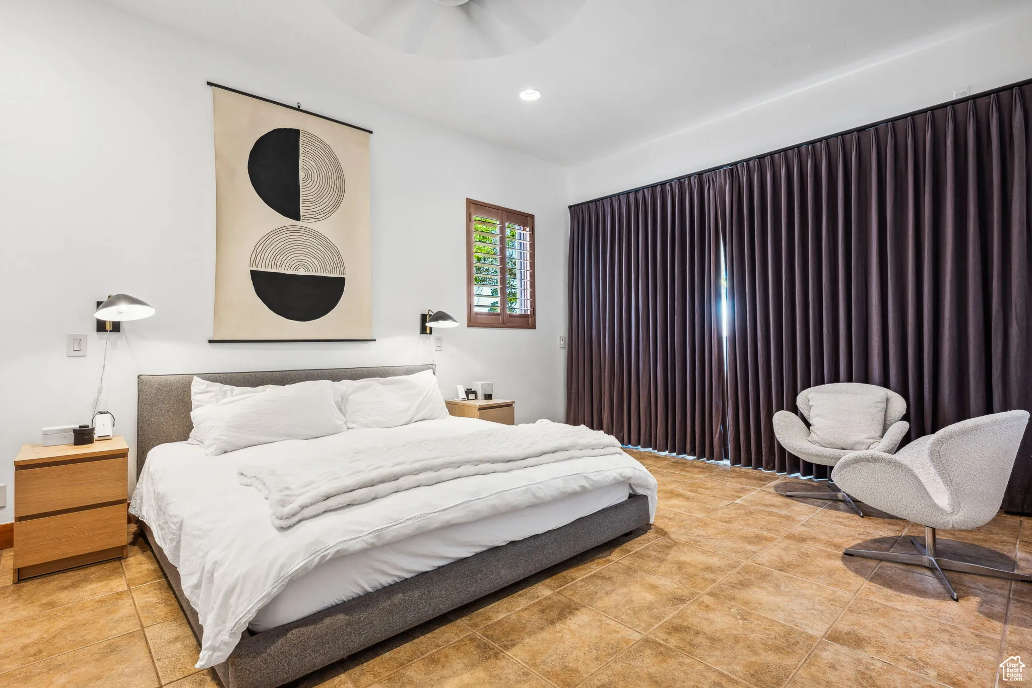 Bedroom with light tile patterned floors and recessed lighting