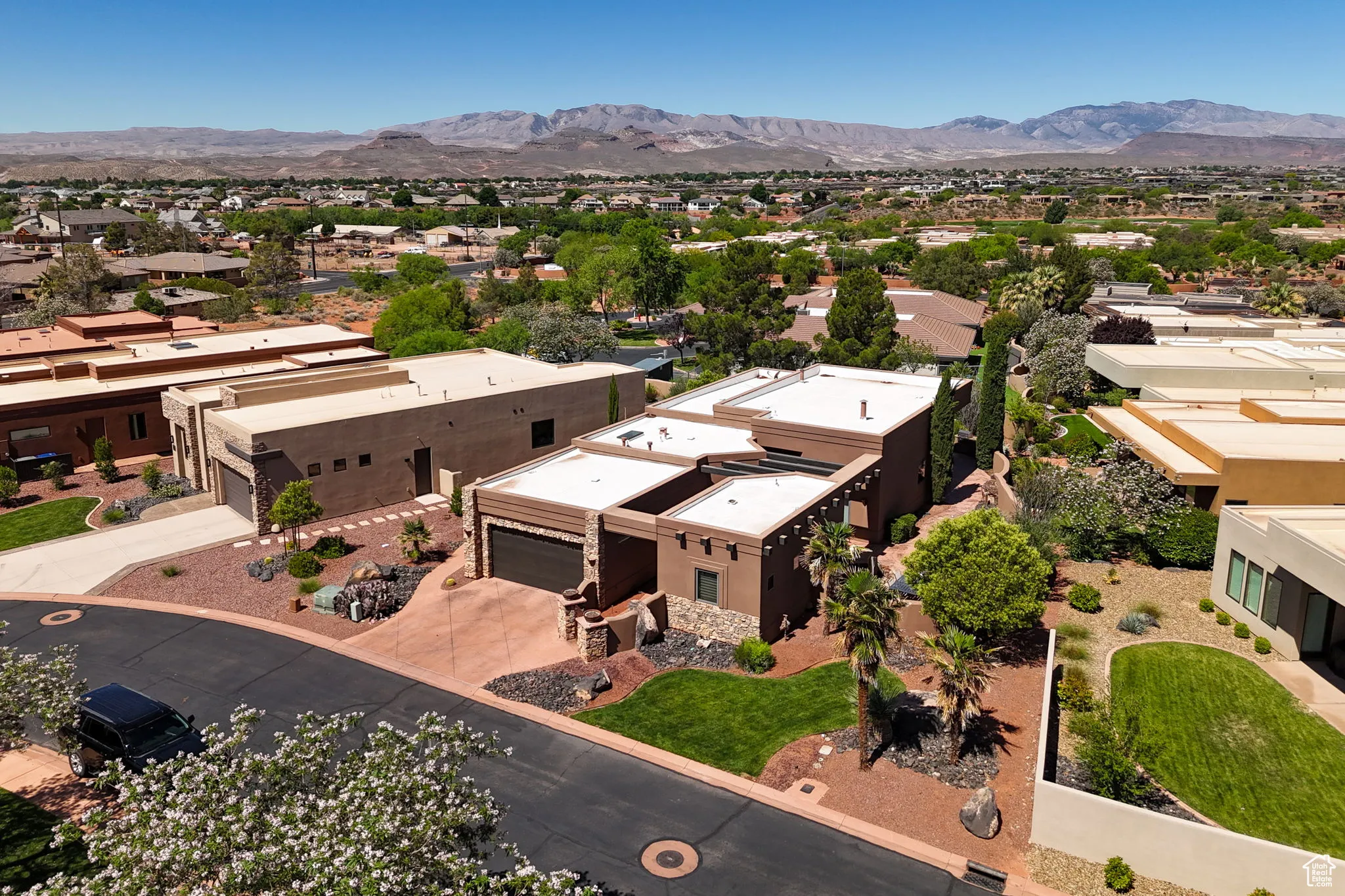 Aerial perspective of suburban area with a mountain backdrop