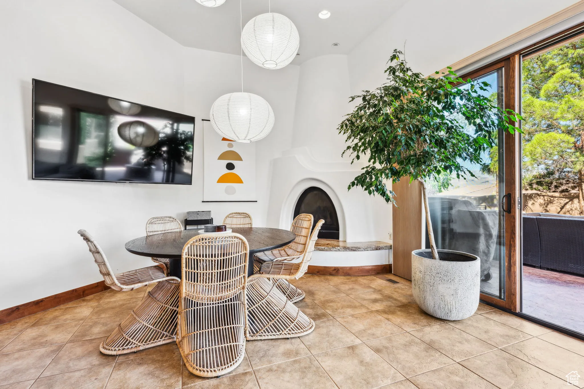 Dining room featuring tile patterned floors and baseboards
