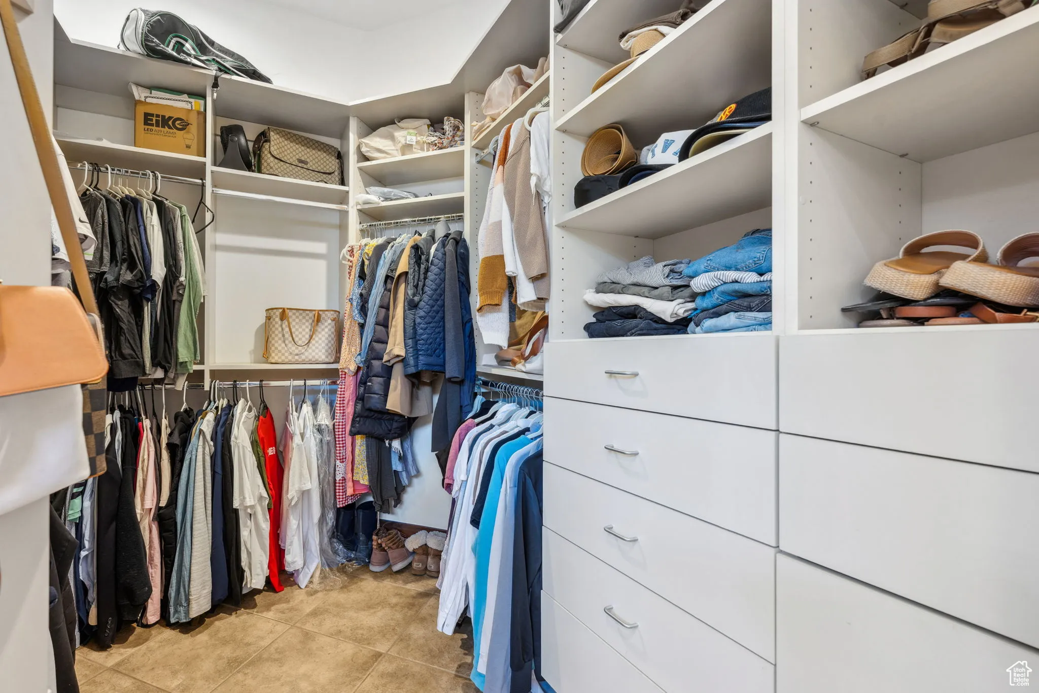 Walk in closet with tile patterned floors