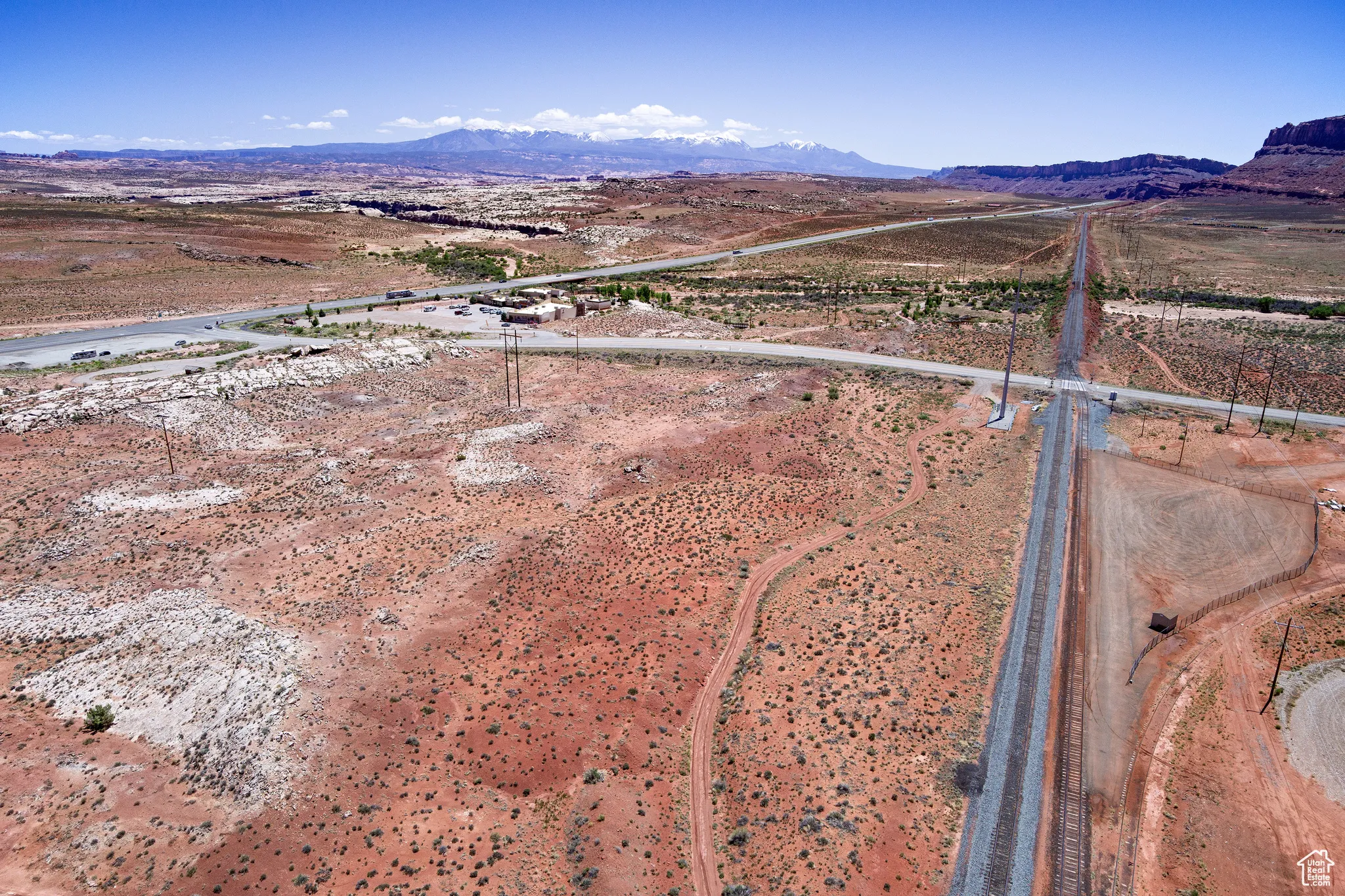 Overview of rural landscape featuring a mountainous background