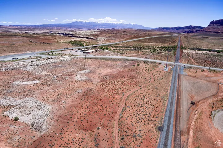 Overview of rural landscape featuring a mountainous background