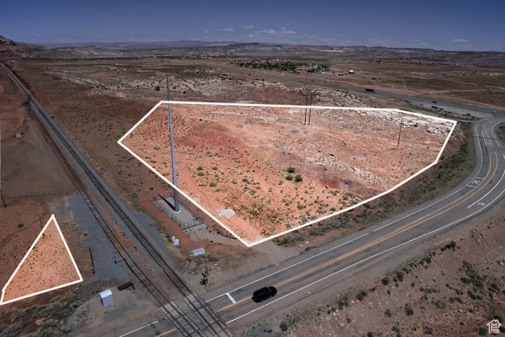 Overview of rural landscape with property boundaries highlighted, a desert landscape, and mountains