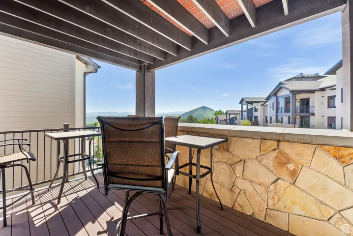 Wooden terrace featuring a residential view