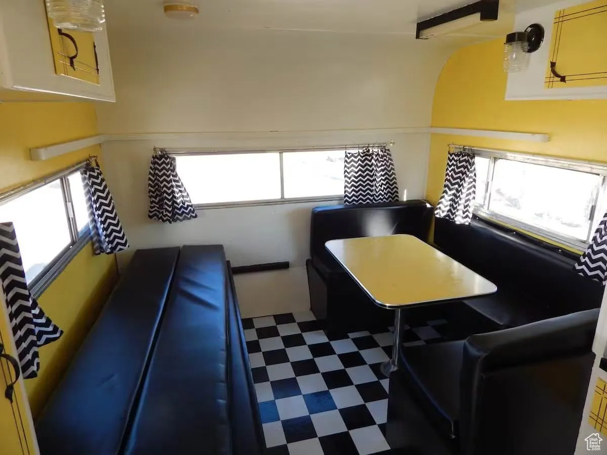 Kitchen with tile patterned floors and healthy amount of natural light
