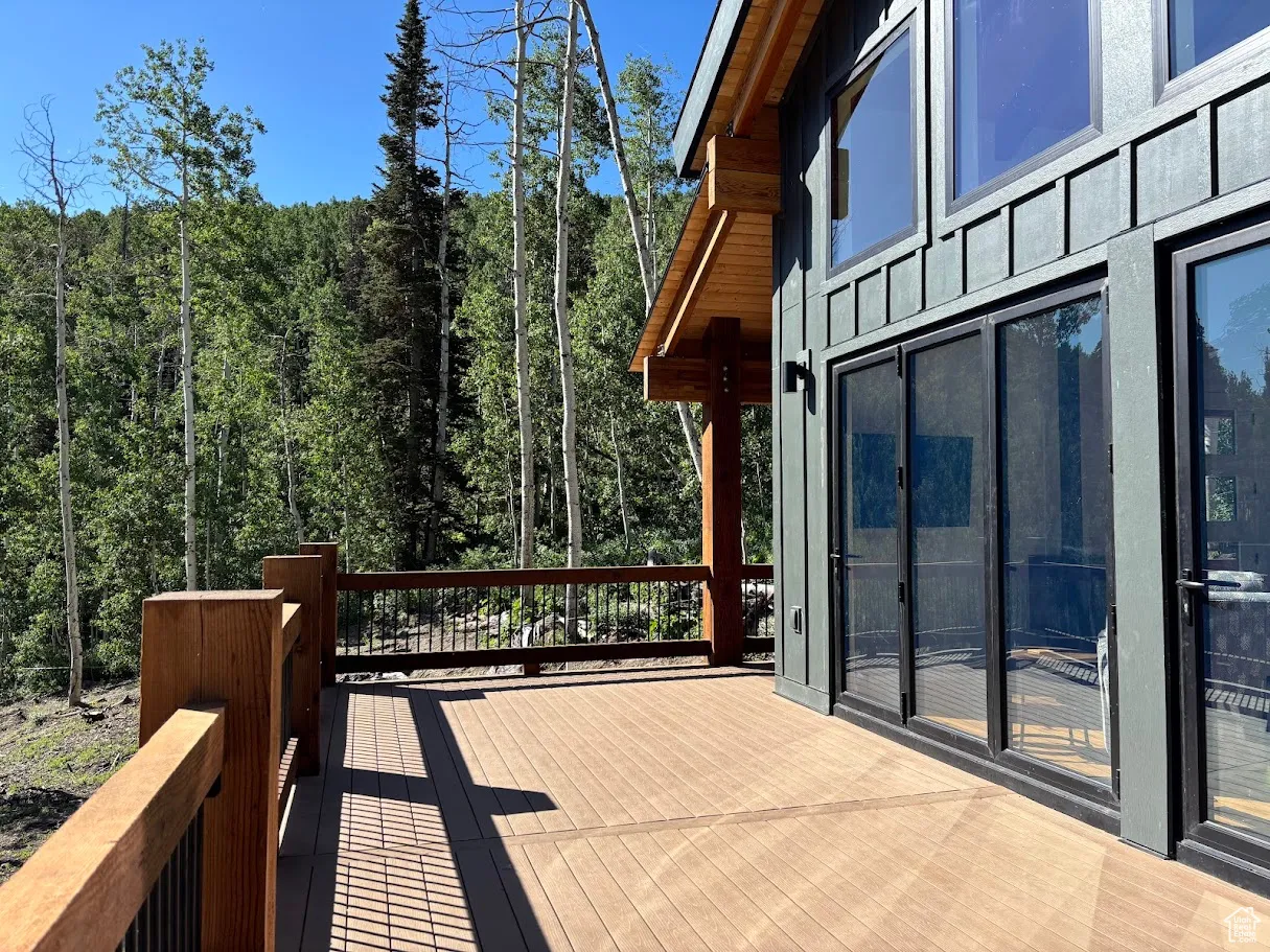 Deck featuring a wooded view