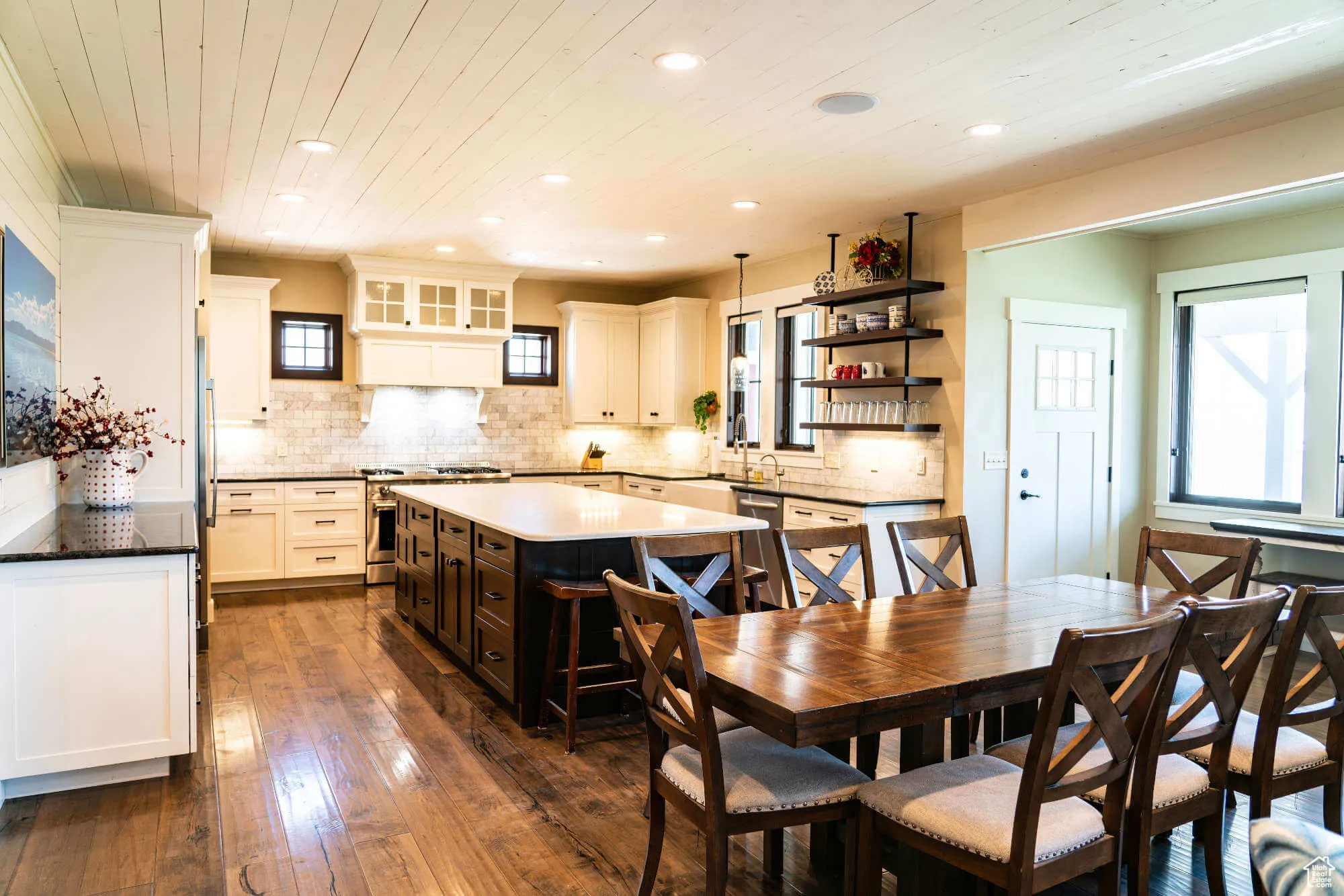 Dining area featuring recessed lighting, dark wood-type flooring, plenty of natural light, and wood ceiling