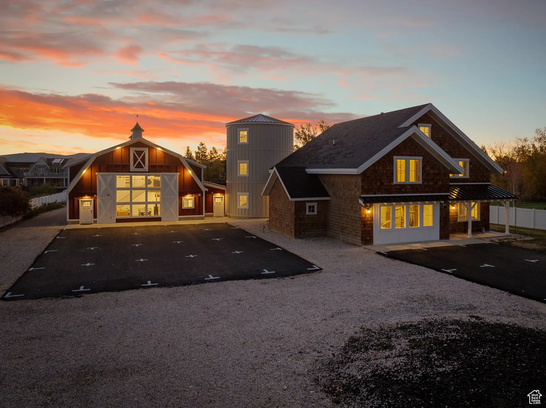 View of front of house featuring a barn and an outbuilding