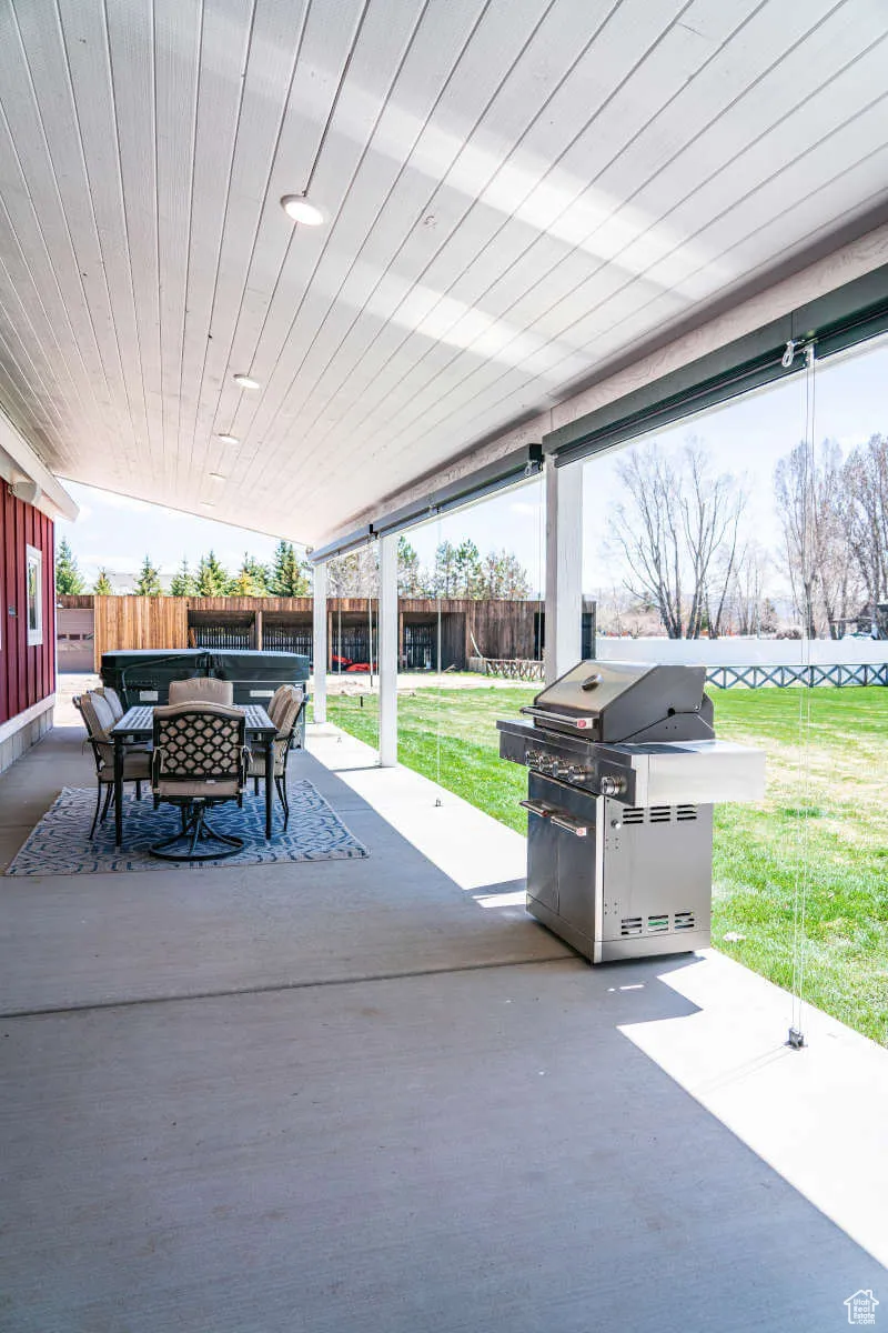 View of patio / terrace featuring area for grilling and outdoor dining area