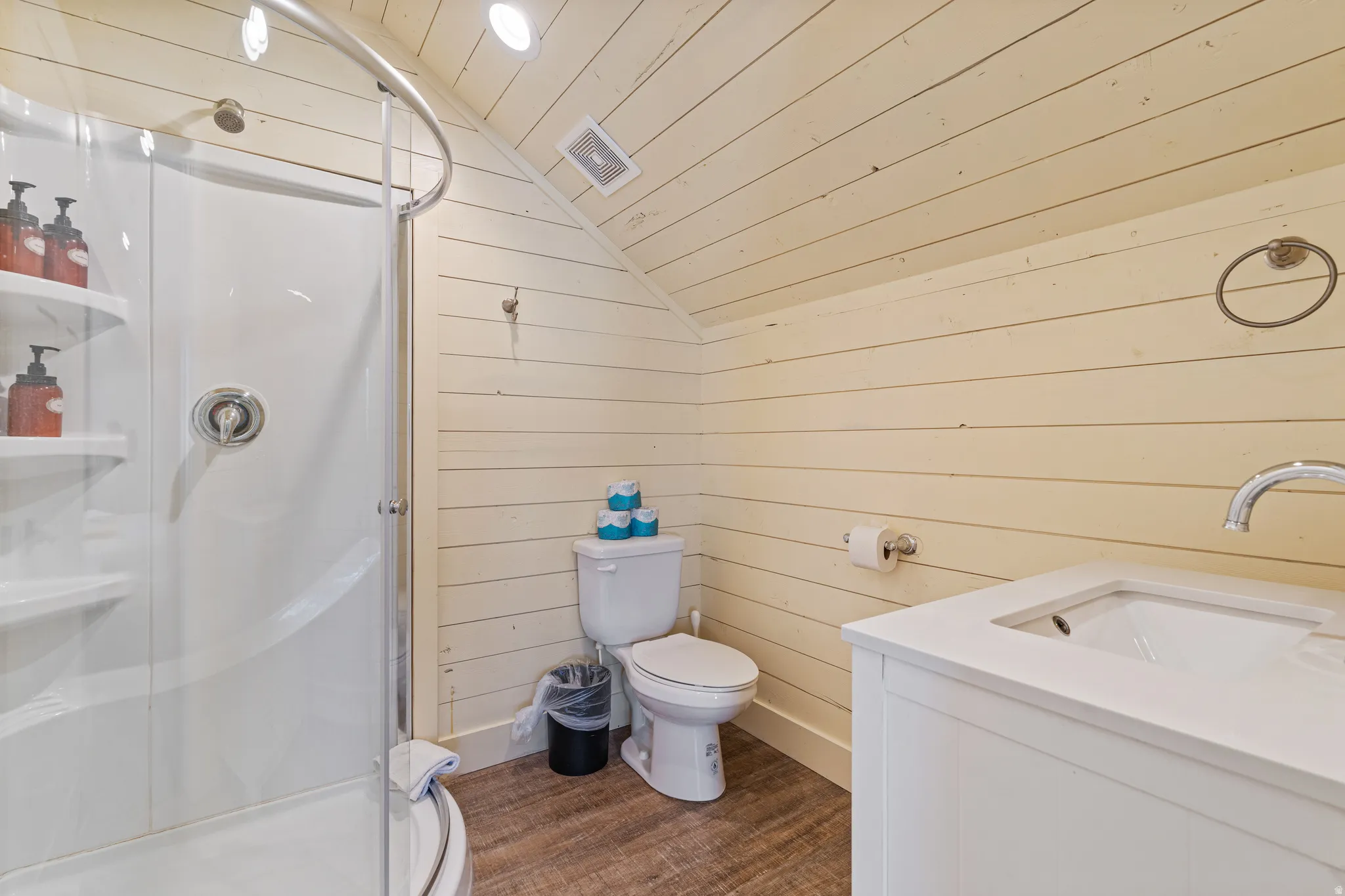 Corner shower with curved glass enclosure